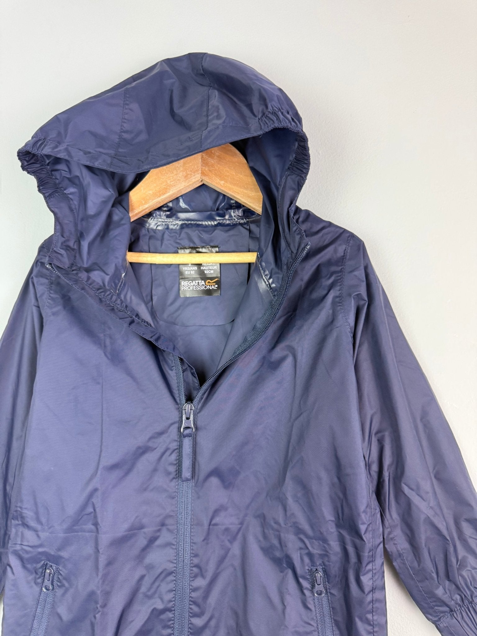 Ex Regatta Black Navy Packaway Rain Jacket - Unisex 2 - 13 Years - Discounted high street clothing for children, ladies and men including everyday wear and seasonal styles. UK online