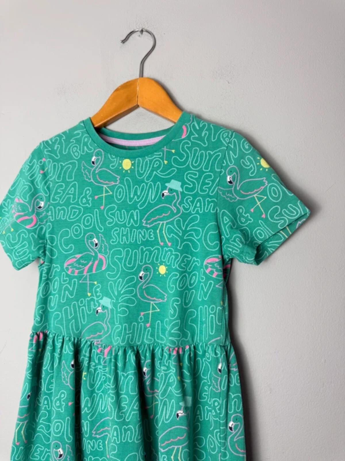 M&S Green Flamingo Summer Short Sleeve Dress - Girls 6 - 7 Years 122cm - Discounted high street clothing for children, ladies and men including everyday wear and seasonal styles. UK online