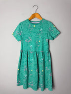 M&S Green Flamingo Summer Short Sleeve Dress - Girls 6 - 7 Years 122cm - Discounted high street clothing for children, ladies and men including everyday wear and seasonal styles. UK online