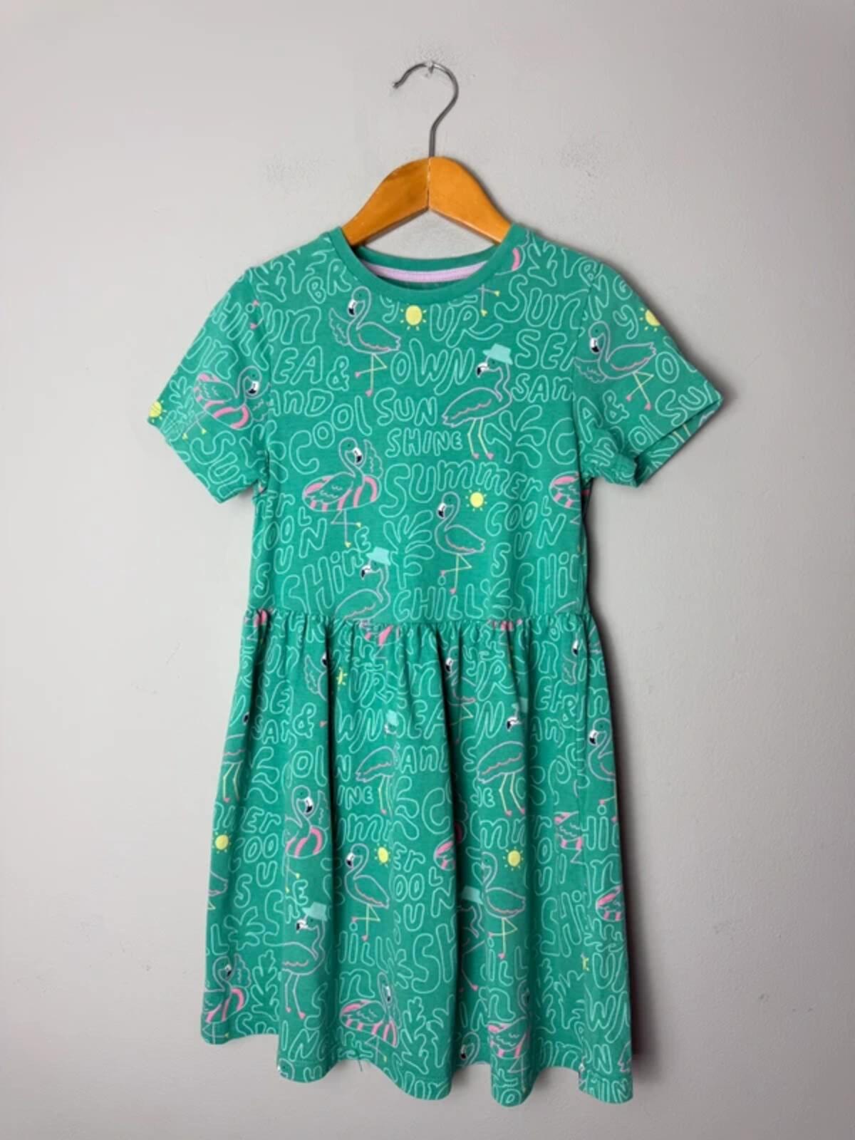 M&S Green Flamingo Summer Short Sleeve Dress - Girls 6 - 7 Years 122cm - Discounted high street clothing for children, ladies and men including everyday wear and seasonal styles. UK online